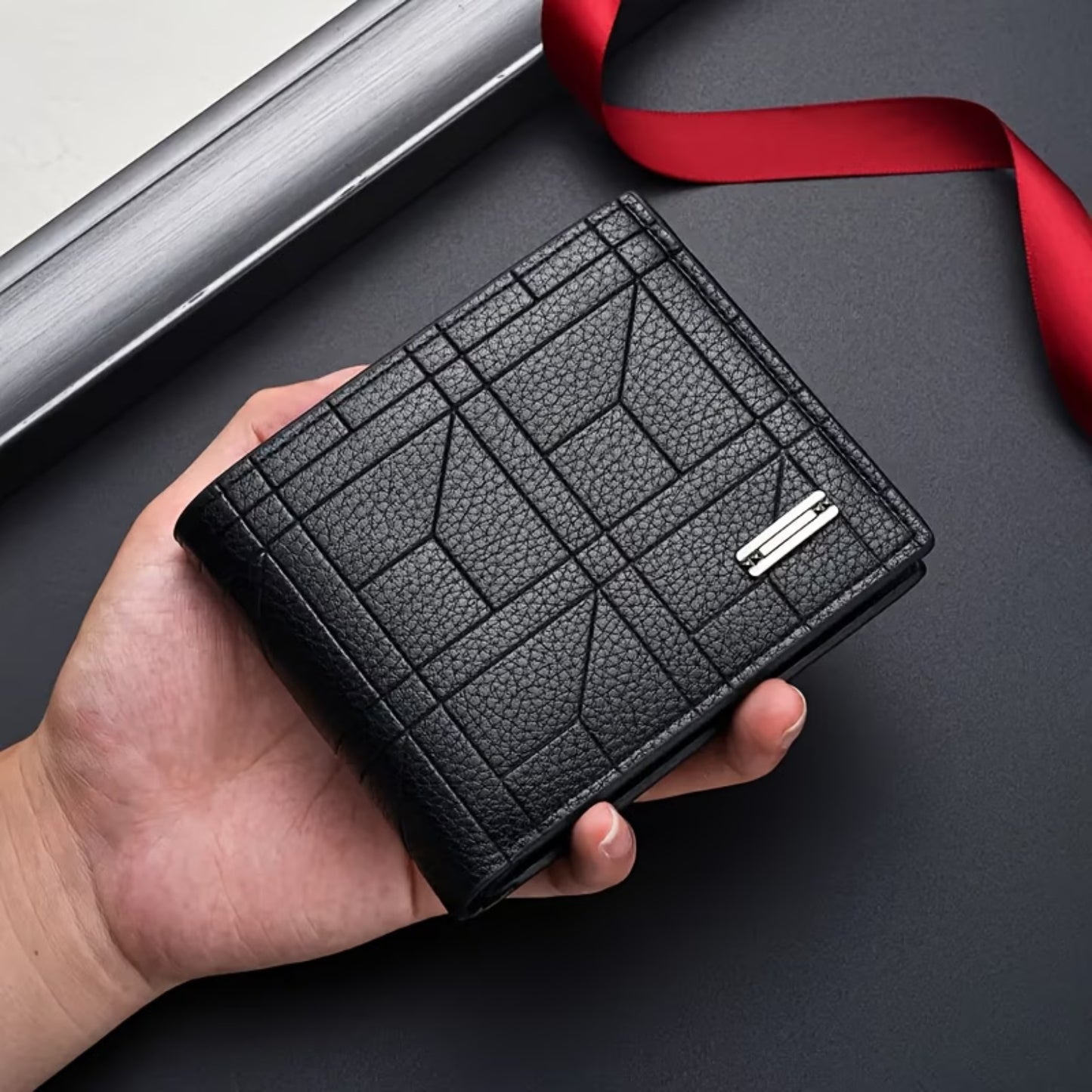 A modern Wallet for Men Branded by Nayvo Noir, easily held in hand to show its Small Size.