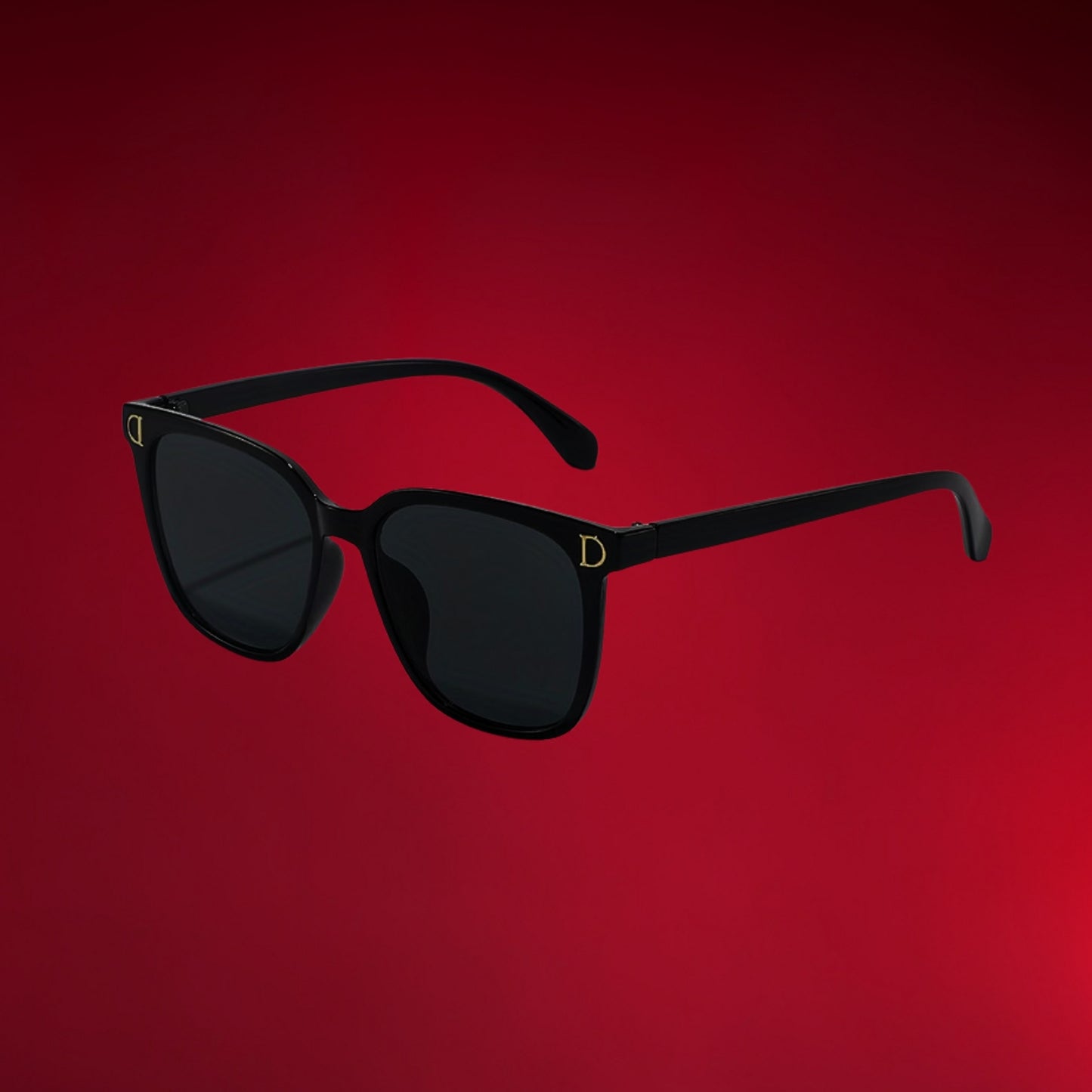 Close-up of premium UV400 lenses on black oversized sunglasses providing 100% UV protection.