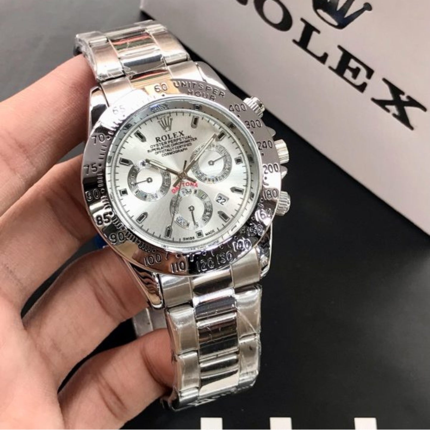 Front View: Rolex Daytona Black Bezel White Dial Luxury Watch Close-up.